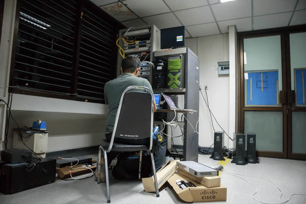 Cybergate technician repairing server and IT hardware onsite in Malaysia